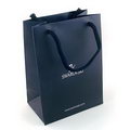 Black color Matte Paper Shopping bag with white trademark